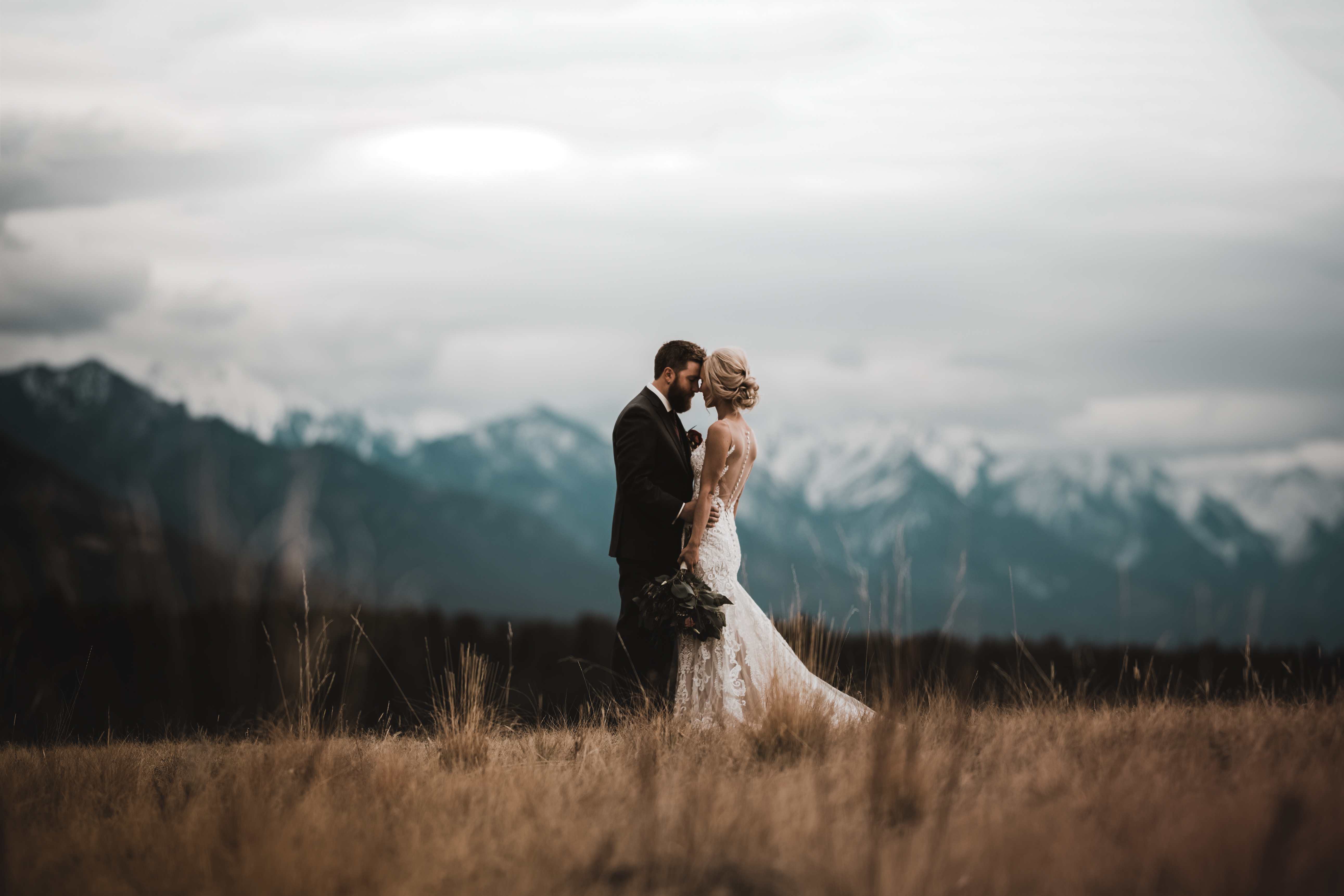 Calgary wedding photographer in Invermere for adventurous mountain destination elopement at Eagle Ranch Golf Resort, British Columbia - Featured