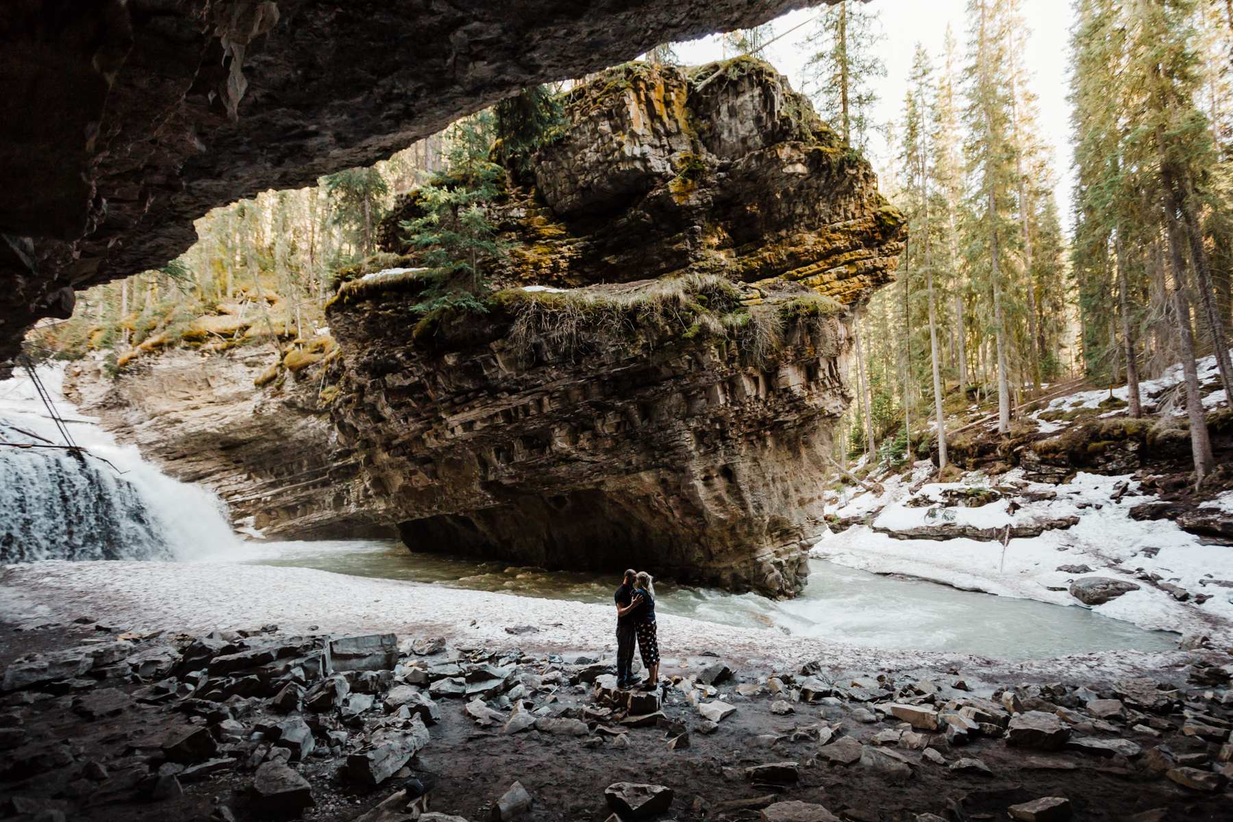 Banff Engagement Photographers at Johnston Canyon Cave for an adventurous session in Banff National Park