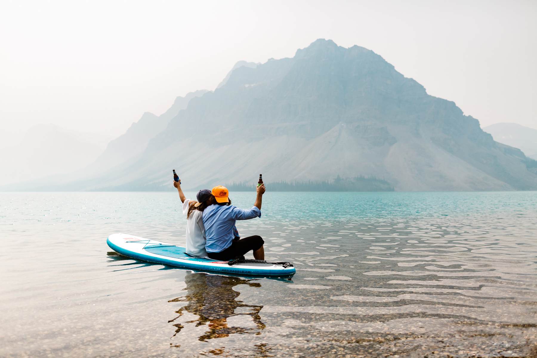 Adventure Elopement Photographers in Banff National Park at Moraine and SUP on Bow Lake
