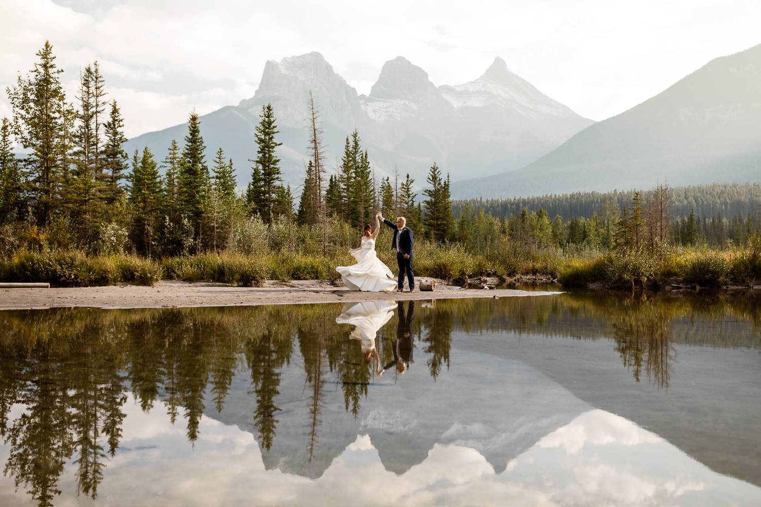 Canmore wedding photographers with the Three Sisters mountains